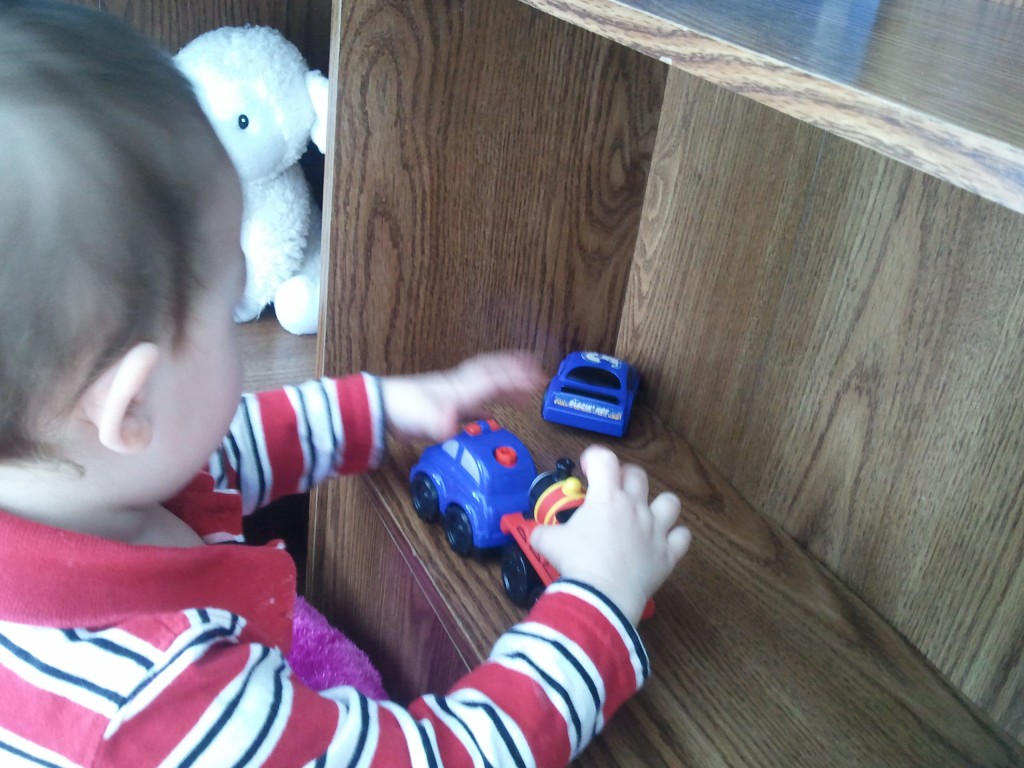 Kyler playing with cars